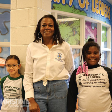  Photo of Principal Cale with 2 students from Jones ES